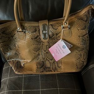 Brown snake skin zippered tote .